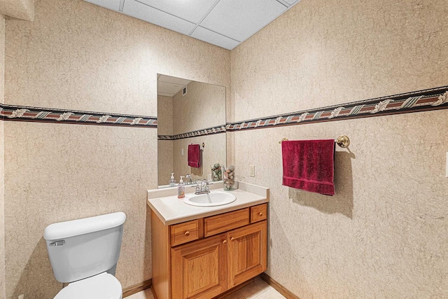 705 Red Fox, Fond Du Lac, WI 54937 - bathroom featuring vanity, toilet, and a paneled ceiling