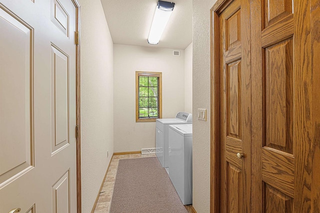 705 Red Fox, Fond Du Lac, WI 54937 - washroom featuring washer and dryer, baseboards, and a textured wall