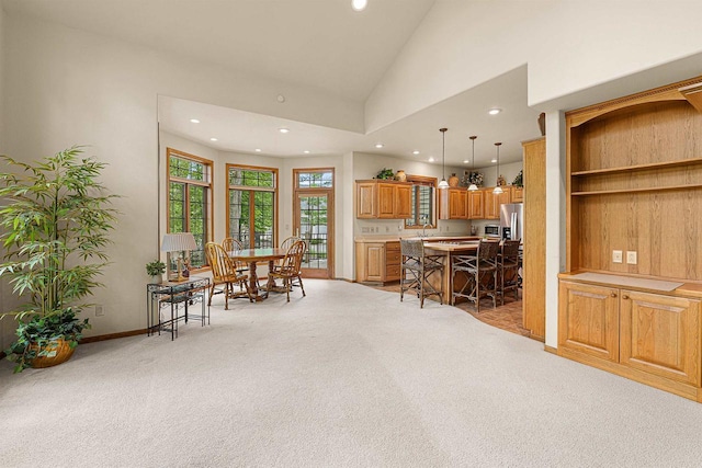 705 Red Fox, Fond Du Lac, WI 54937 - dining room with recessed lighting, light colored carpet, vaulted ceiling, and baseboards
