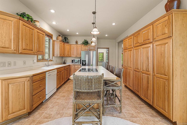 705 Red Fox, Fond Du Lac, WI 54937 - kitchen featuring appliances with stainless steel finishes, a sink, recessed lighting, light countertops, and a center island
