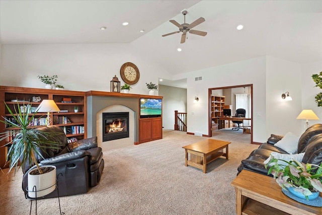 7197 Welford Pl, Sun Prairie, WI 53590 - living area with light colored carpet, ceiling fan, recessed lighting, a fireplace, and high vaulted ceiling