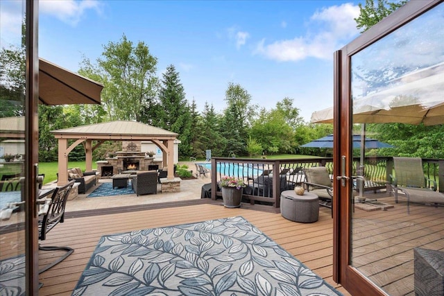 7197 Welford Pl, Sun Prairie, WI 53590 - wooden terrace featuring a gazebo and an outdoor living space with a fireplace