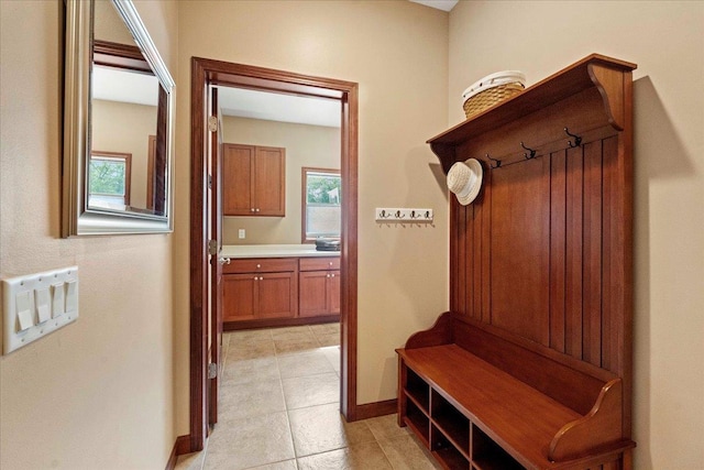 7197 Welford Pl, Sun Prairie, WI 53590 - mudroom with baseboards, light tile patterned floors, and healthy amount of natural light