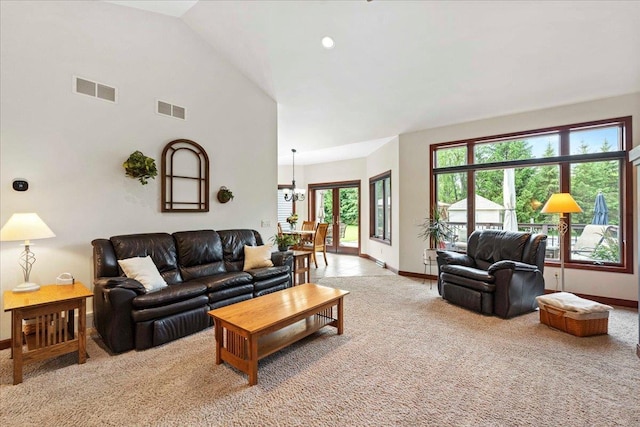 7197 Welford Pl, Sun Prairie, WI 53590 - living room featuring baseboards, light carpet, a chandelier, and lofted ceiling