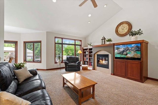 7197 Welford Pl, Sun Prairie, WI 53590 - living room with carpet floors, baseboards, a tiled fireplace, recessed lighting, and high vaulted ceiling