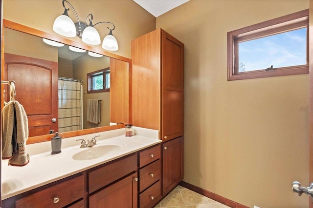 7197 Welford Pl, Sun Prairie, WI 53590 - bathroom with vanity, baseboards, and tile patterned floors