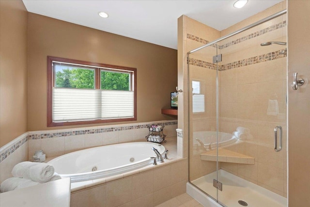 7197 Welford Pl, Sun Prairie, WI 53590 - full bath featuring a jetted tub, a stall shower, and recessed lighting