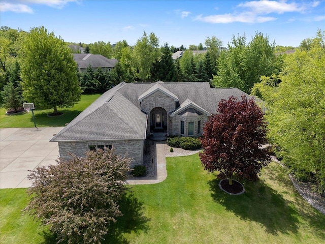 7197 Welford Pl, Sun Prairie, WI 53590 - view of front of house featuring stone siding and a front lawn