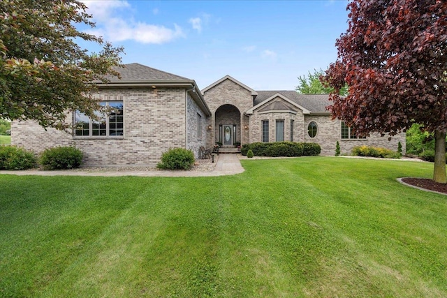 7197 Welford Pl, Sun Prairie, WI 53590 - french provincial home with a front lawn and brick siding