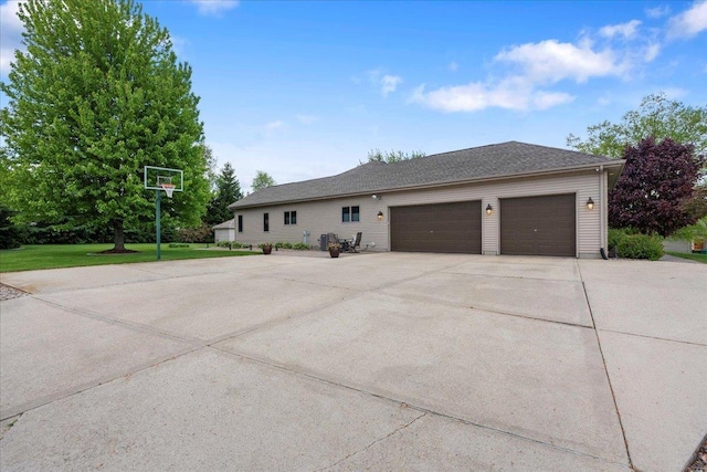 7197 Welford Pl, Sun Prairie, WI 53590 - view of side of property with an attached garage, driveway, and a yard
