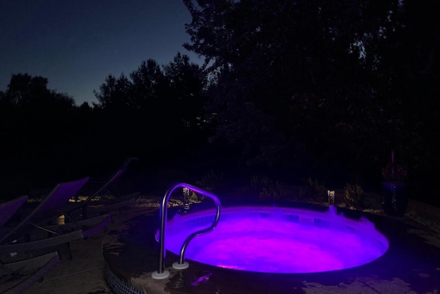 7197 Welford Pl, Sun Prairie, WI 53590 - pool at night with a patio area