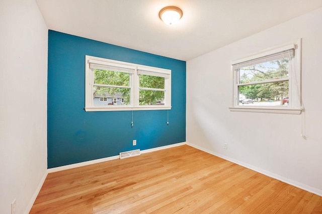 109 Cherry St, Edgerton, WI 53534 - spare room with wood finished floors and baseboards