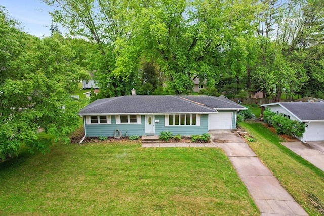 109 Cherry St, Edgerton, WI 53534 - ranch-style home with driveway, a garage, and a front lawn