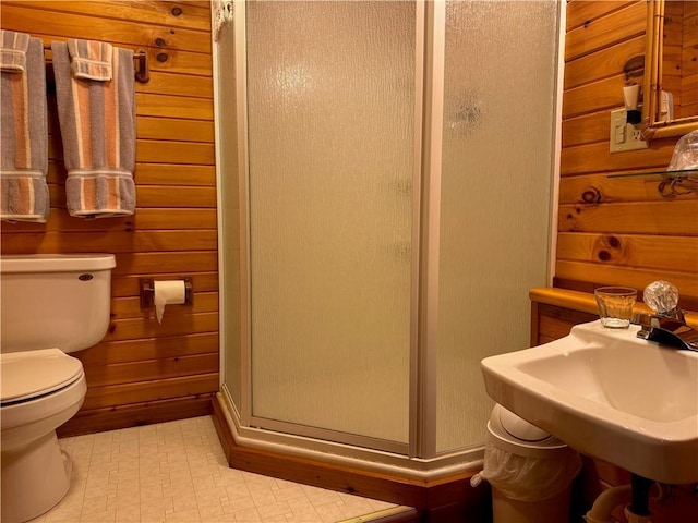16199 W Musky Point Dr, Stone Lake, WI 54843 - bathroom featuring a stall shower, toilet, a sink, and tile patterned floors