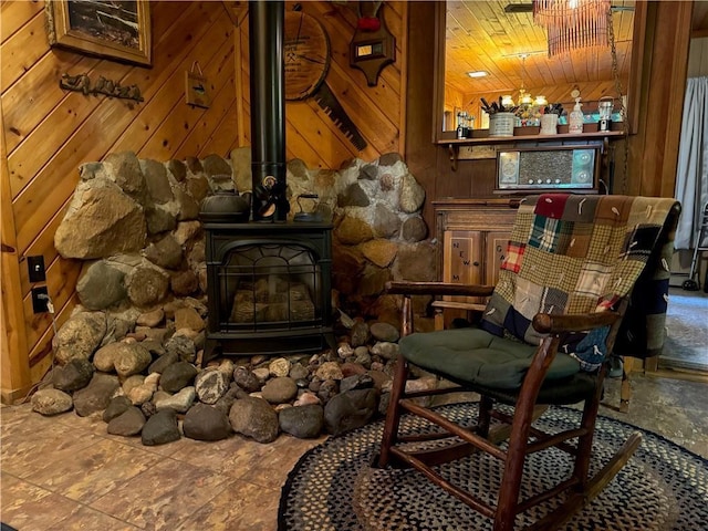 16199 W Musky Point Dr, Stone Lake, WI 54843 - living area with wooden walls, a wood stove, and wood ceiling