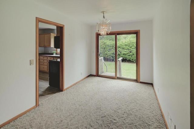 613 Anthony Ln, Madison, WI 53711 - unfurnished dining area featuring light carpet, a chandelier, and baseboards