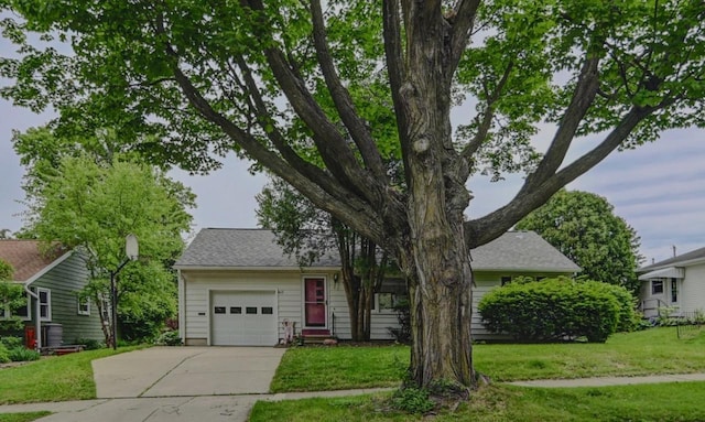 613 Anthony Ln, Madison, WI 53711 - view of front facade featuring driveway, an attached garage, and a front lawn