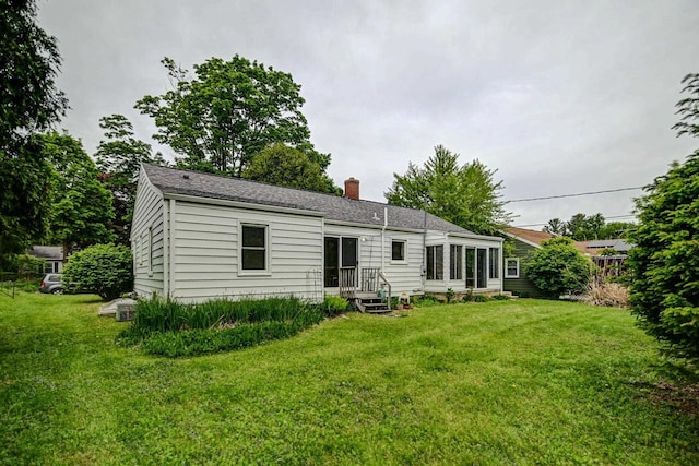 613 Anthony Ln, Madison, WI 53711 - rear view of property featuring a chimney and a yard