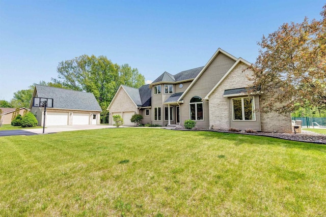 8373 Serenity Ln, Pulaski, WI 54162 - view of front facade featuring a front lawn and a garage