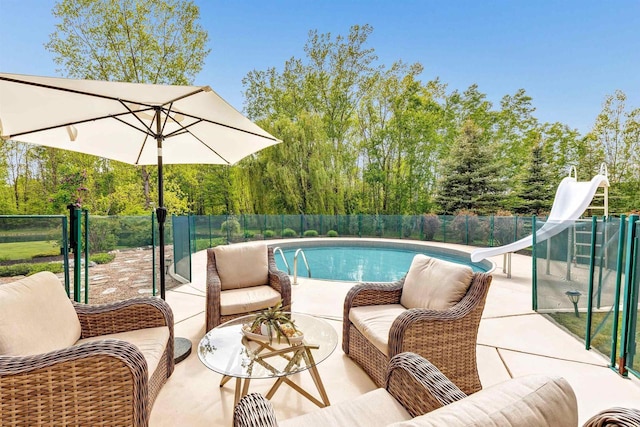 8373 Serenity Ln, Pulaski, WI 54162 - view of pool featuring a water slide, outdoor lounge area, and a patio area
