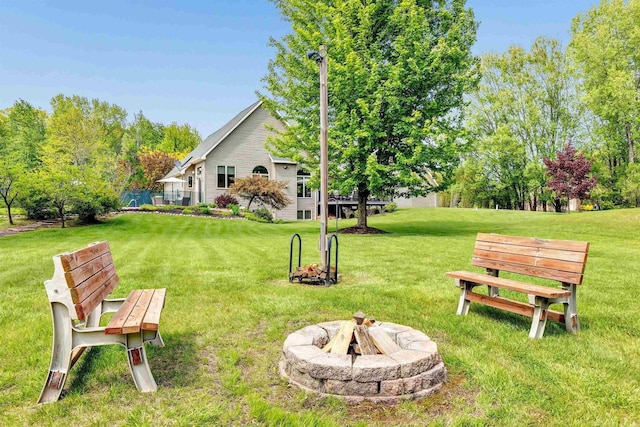 8373 Serenity Ln, Pulaski, WI 54162 - view of grassy yard with a fire pit