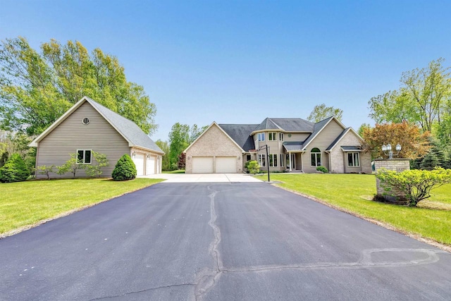 8373 Serenity Ln, Pulaski, WI 54162 - view of front facade featuring a garage and a front yard