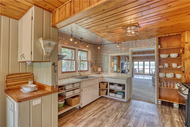 N5757 Division Ave, Stone Lake, WI 54876 - kitchen featuring a sink, light countertops, healthy amount of natural light, gas range, and wood ceiling