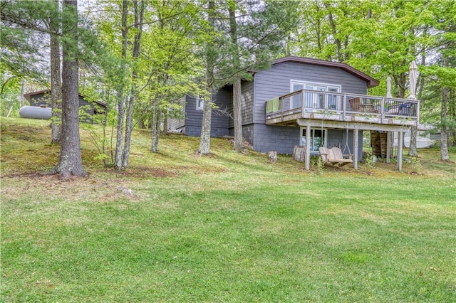 N5757 Division Ave, Stone Lake, WI 54876 - rear view of property featuring a wooden deck and a lawn
