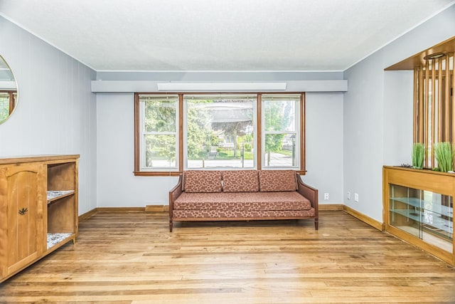 3559 E Van Norman Ave, Cudahy, WI 53110 - living area with crown molding, light wood-style floors, plenty of natural light, and baseboards