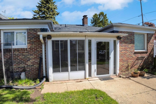 3559 E Van Norman Ave, Cudahy, WI 53110 - entrance to property featuring brick siding, a chimney, and a patio area