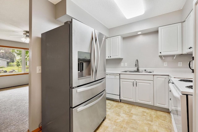 530 Dapin Rd, Madison, WI 53704 - kitchen with white appliances, white cabinetry, ceiling fan, light countertops, and a textured ceiling