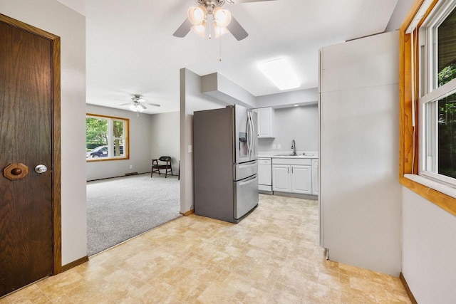 530 Dapin Rd, Madison, WI 53704 - kitchen featuring stainless steel fridge, ceiling fan, white cabinetry, white dishwasher, and light countertops