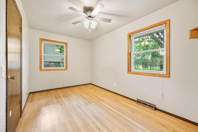 530 Dapin Rd, Madison, WI 53704 - unfurnished room featuring light wood-style flooring, a textured ceiling, and ceiling fan