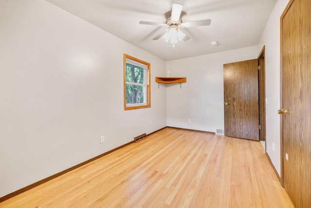 530 Dapin Rd, Madison, WI 53704 - spare room with wood finished floors, a ceiling fan, and a textured ceiling