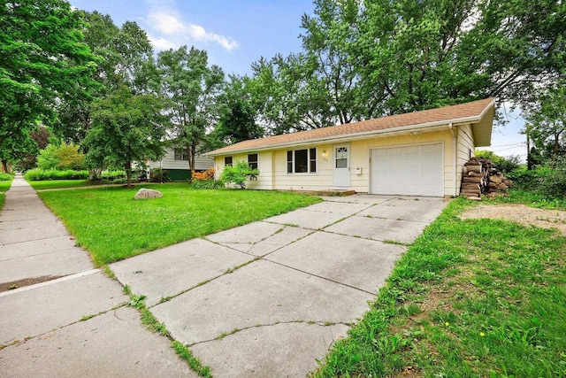 530 Dapin Rd, Madison, WI 53704 - view of front of house with an attached garage, a front lawn, and driveway