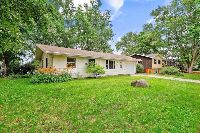 530 Dapin Rd, Madison, WI 53704 - view of front facade featuring an attached garage, driveway, and a front lawn