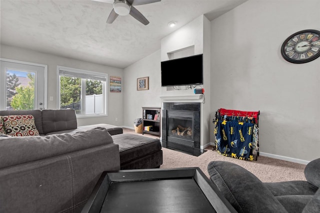 1308 Lavender Ln, Appleton, WI 54915 - living room featuring vaulted ceiling, baseboards, a fireplace with flush hearth, a ceiling fan, and carpet flooring
