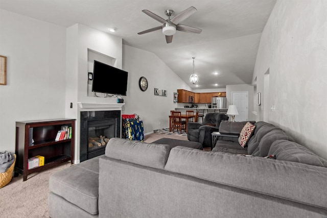 1308 Lavender Ln, Appleton, WI 54915 - carpeted living area with a ceiling fan, lofted ceiling, and a premium fireplace