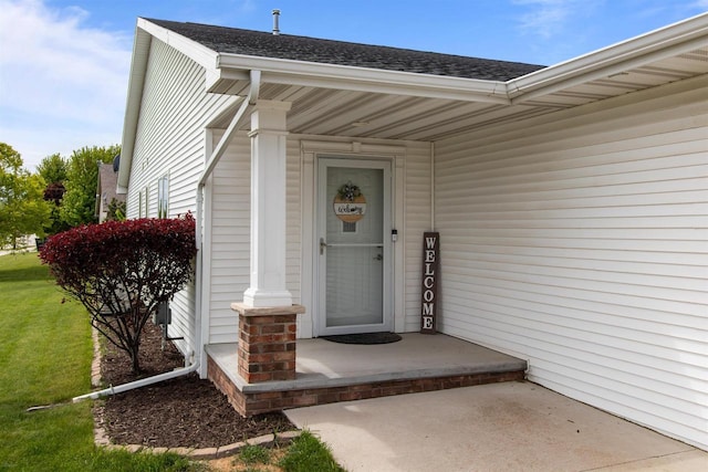 1308 Lavender Ln, Appleton, WI 54915 - view of exterior entry featuring roof with shingles and a yard