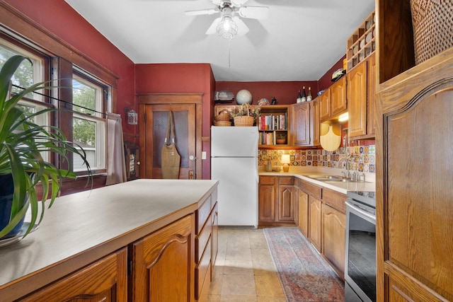 224 E Atlantic St, Appleton, WI 54911 - kitchen featuring freestanding refrigerator, stove, a sink, light countertops, and a ceiling fan