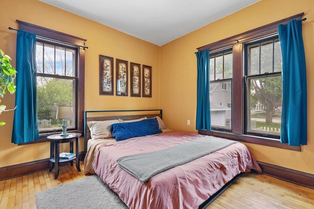 224 E Atlantic St, Appleton, WI 54911 - bedroom featuring hardwood / wood-style flooring, multiple windows, and baseboards