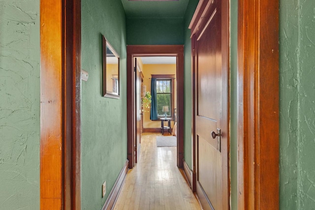 224 E Atlantic St, Appleton, WI 54911 - hallway with light wood finished floors, baseboards, and a textured wall