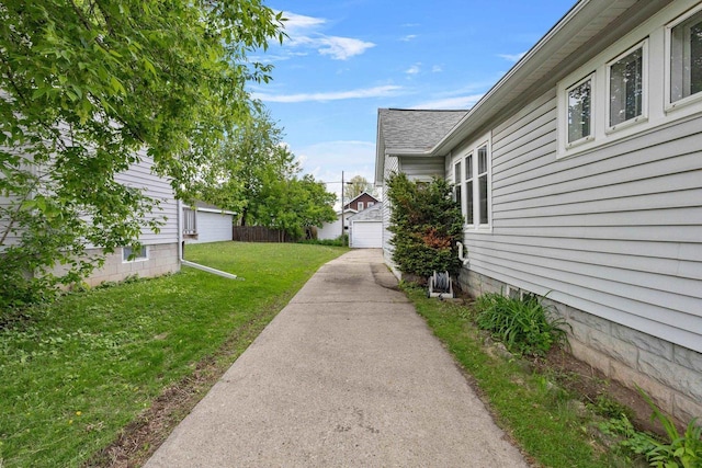 224 E Atlantic St, Appleton, WI 54911 - view of green lawn with a detached garage