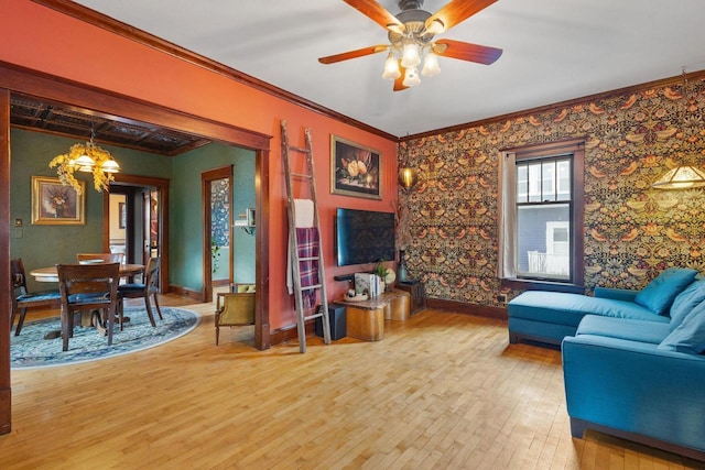 224 E Atlantic St, Appleton, WI 54911 - living room featuring a chandelier, light wood-type flooring, crown molding, baseboards, and ceiling fan