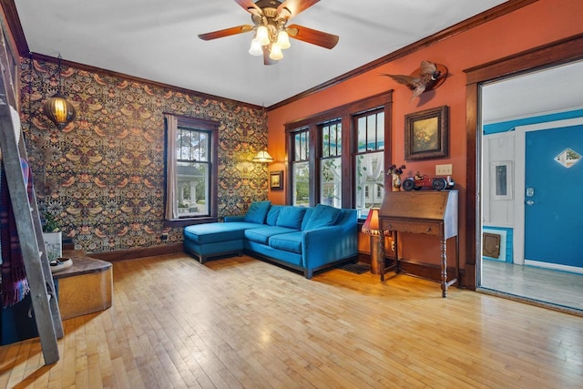 224 E Atlantic St, Appleton, WI 54911 - living room featuring hardwood / wood-style flooring, baseboards, ceiling fan, crown molding, and wallpapered walls