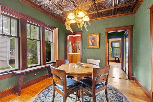 224 E Atlantic St, Appleton, WI 54911 - dining area featuring a textured wall, healthy amount of natural light, an ornate ceiling, light wood finished floors, and a chandelier