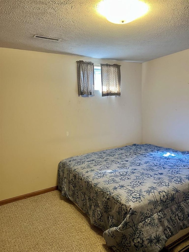 2335 Granite Ter Unit 32, Beloit, WI 53511 - bedroom featuring light colored carpet and a textured ceiling