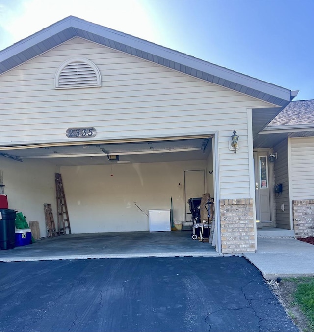 2335 Granite Ter Unit 32, Beloit, WI 53511 - garage with asphalt driveway