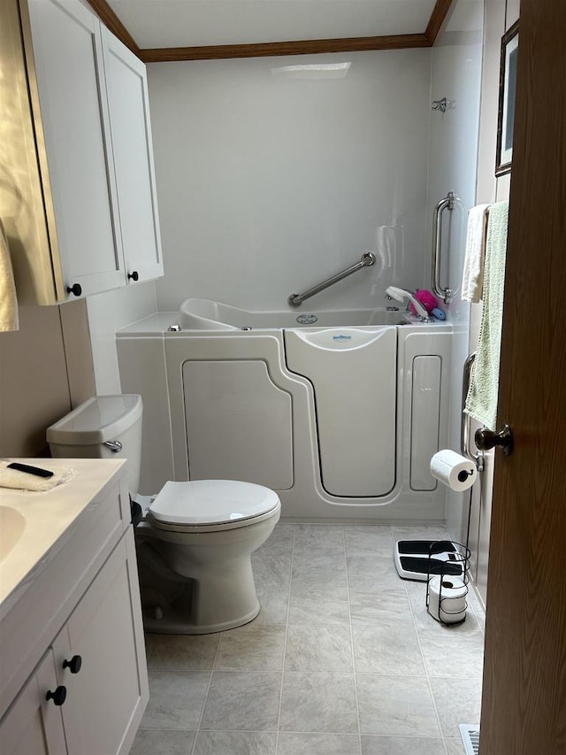 715 Oak St, Shawano, WI 54166 - full bath featuring a garden tub, crown molding, toilet, vanity, and tile patterned flooring