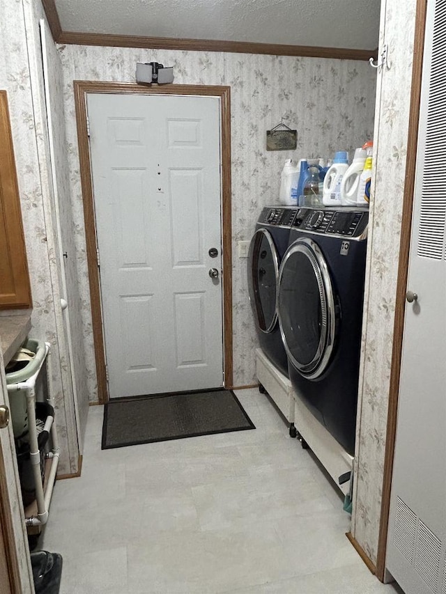 715 Oak St, Shawano, WI 54166 - laundry room with washer and clothes dryer, a heating unit, ornamental molding, wallpapered walls, and light floors
